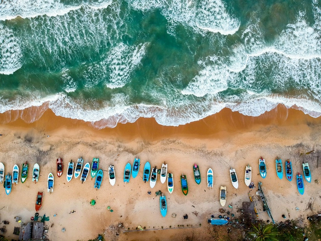 Aerial view of colourful fishing boats along the Sri Lankan coast
